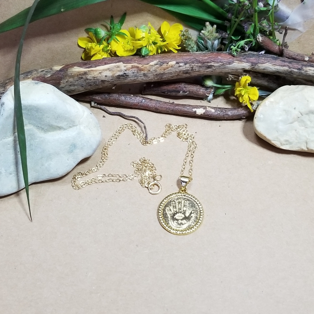 Gold hamsa hand necklace